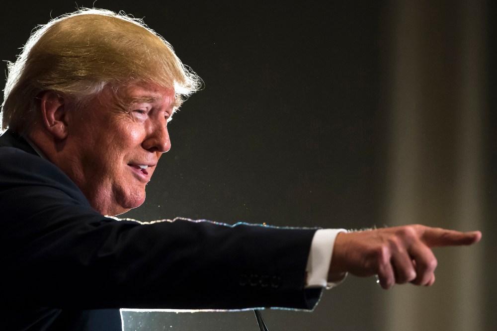 Republican presidential candidate Donald Trump points while speaking to the crowd at a campaign stop in Hilton Head Island, S.C., Dec. 30, 2015. (Photo by Stephen B. Morton/AP)