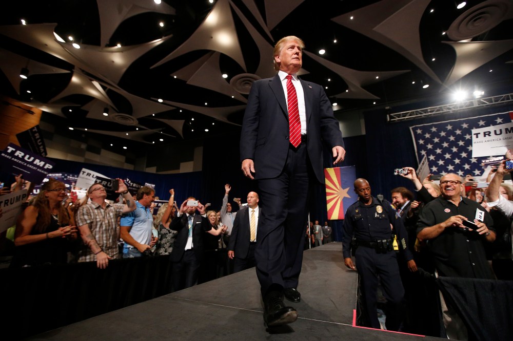 Republican presidential candidate Donald Trump walks on stage to speak before a crowd of 3,500 on July 11, 2015, in Phoenix, Ariz. (Photo by Ross D. Franklin/AP)