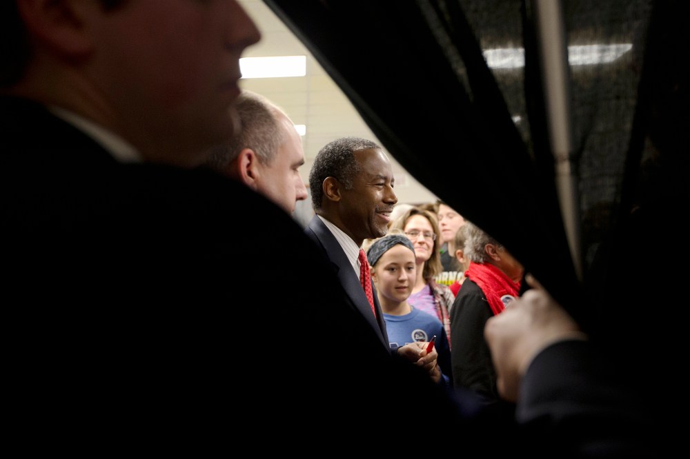 Republican presidential candidate Dr. Ben Carson, center, shakes hands with supporters at a town hall, Jan. 6, 2016, in Panora, Iowa. (Photo by Jae C. Hong/AP)