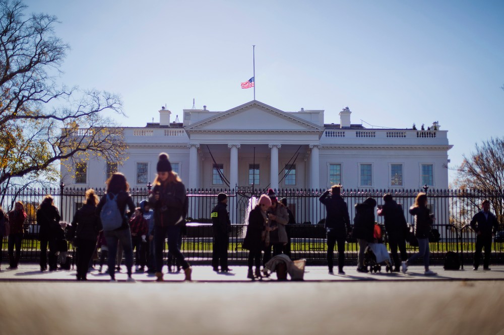 An American flag is seen at half-staff above the White House in Washington, Dec. 3, 2015. (Photo by Pablo Martinez Monsivais/AP)