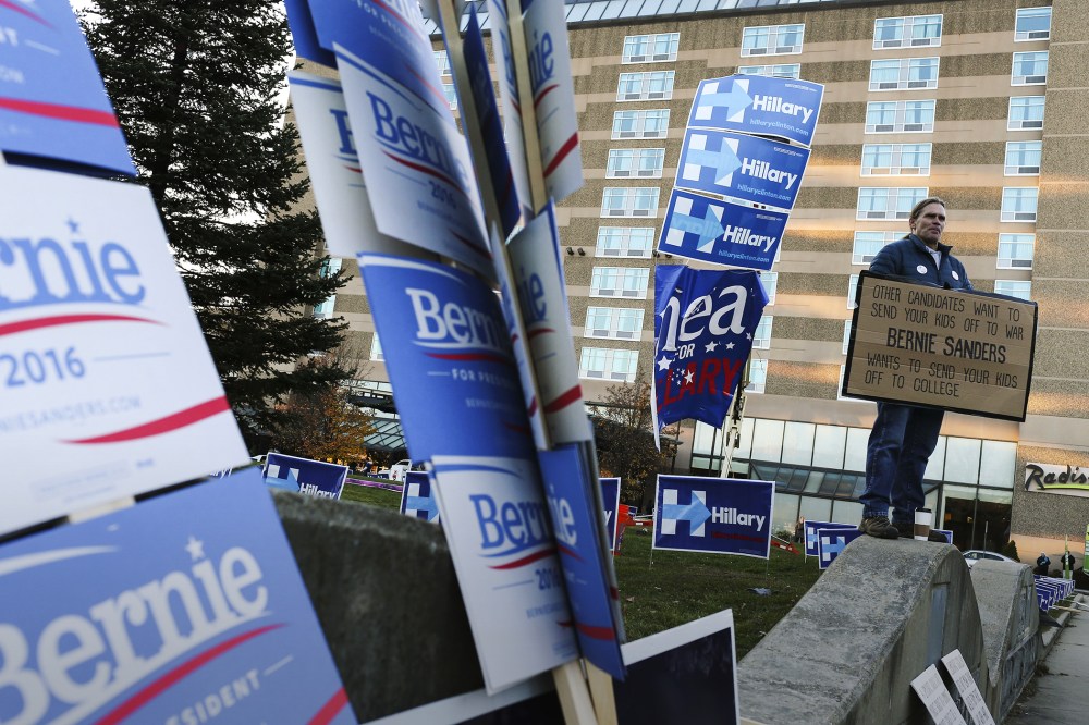 Supporters' signs rest outside of the New Hampshire Democratic Party's annual Jefferson Jackson dinner in Manchester, N.H., Nov. 29, 2015. (Photo by Cheryl Senter/AP)