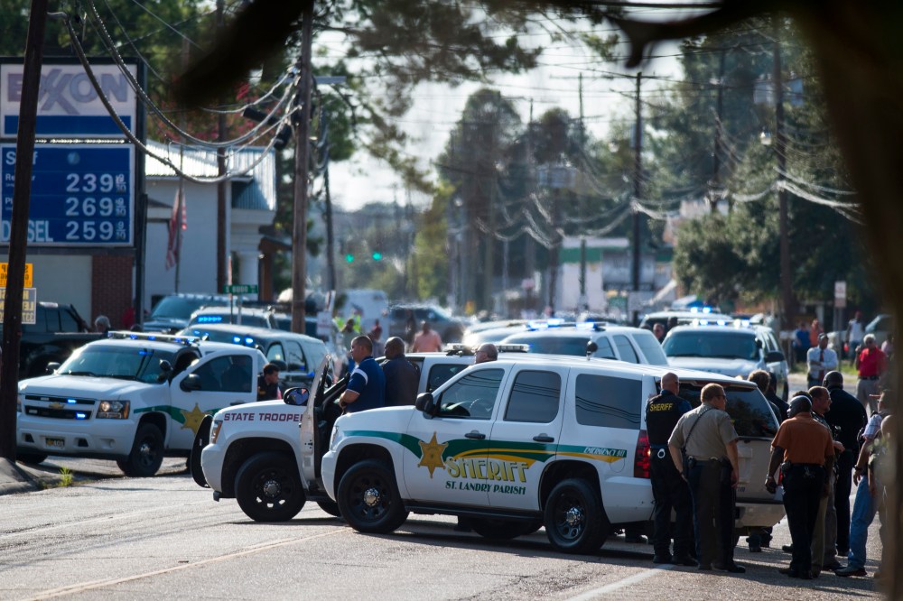 Police gather at the scene of a shooting in Sunset, La. on Aug. 26, 2015. (Photo by Paul Kieu/The Daily Advertiser/AP)