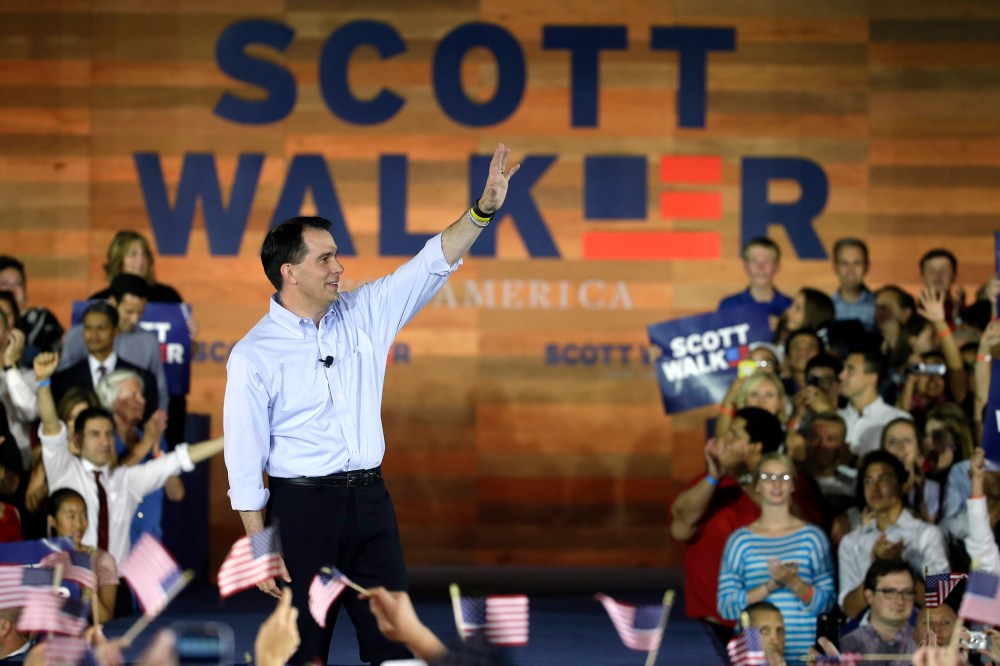 Wisconsin Gov. Scott Walker waves to supporters as he announces he is running for the 2016 Republican presidential nomination at the Waukesha County Expo Center on July 13, 2015, in Waukesha, Wis. (Photo by Morry Gash/AP)