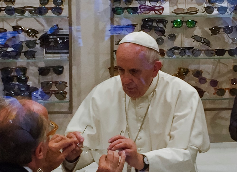 Pope Francis tries on a pair of spectacles in an eyeglass store in via del Babuino, in central Rome, Italy on  Sept. 3, 2015. (Photo by Daniel Soehne/AP)