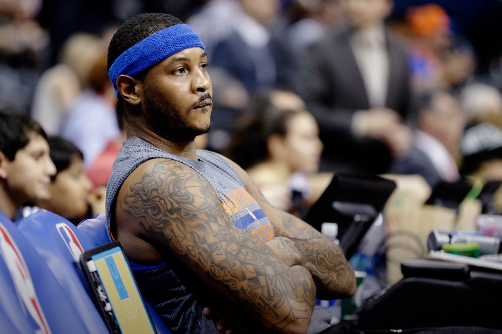 New York Knicks' Carmelo Anthony sits on the bench before the start of an NBA basketball game against the Atlanta Hawks, Dec. 26, 2015, in Atlanta. (Photo by David Goldman/AP)