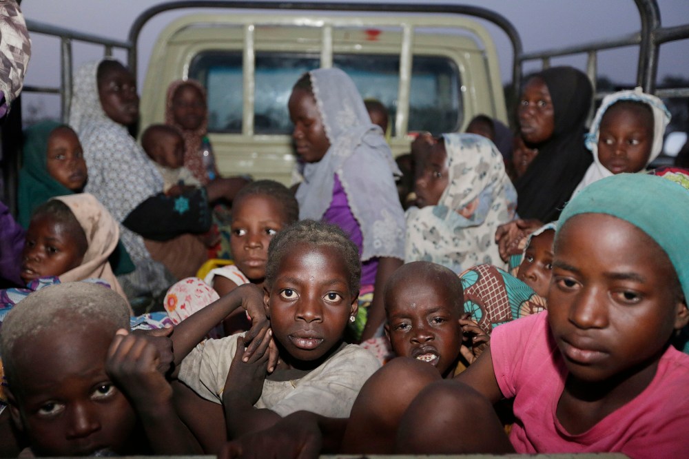 In this Saturday May 2, 2015 file photo, women and children rescued by Nigerian soldiers from Boko Haram at Sambisa forest arrive at a camp for the displaced people in Yola, Nigeria. (Photo by Sunday Alamba/AP)
