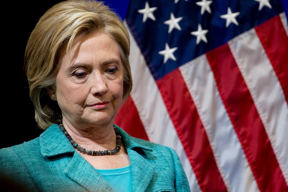 Democratic presidential candidate Hillary Clinton pauses as she is introduced to speak at the Brookings Institution in Washington on Sept. 9, 2015. (Photo by Carolyn Kaster/AP)