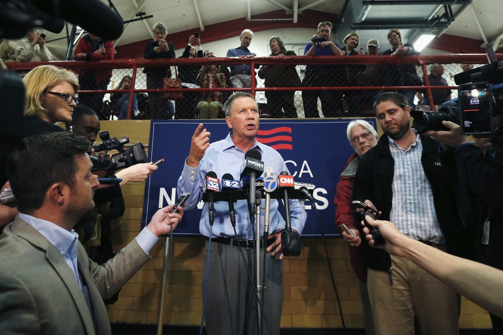 Republican presidential candidate, Ohio Gov. John Kasich responds to a reporter's question after a town hall meeting, March 9, 2016, in Palatine, Ill. (Photo by Charles Rex Arbogast/AP)