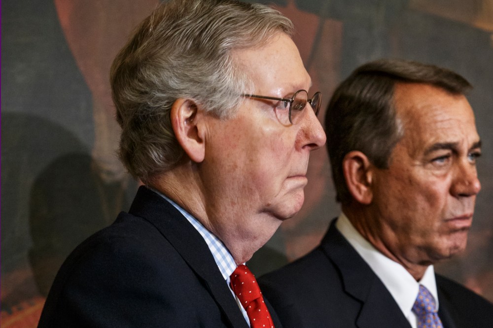 Senate Majority Leader Mitch McConnell of Ky., left, and House Speaker John Boehner of Ohio, stand together on Capitol Hill in Washington on Feb. 13, 2015. (Photo by J. Scott Applewhite/AP)