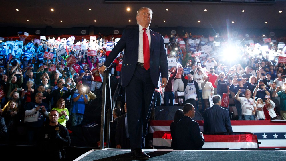 Republican presidential candidate Donald Trump arrives to speak at a campaign rally, Oct. 13, 2016, in Cincinnati, Ohio. (Photo by Evan Vucci/AP)