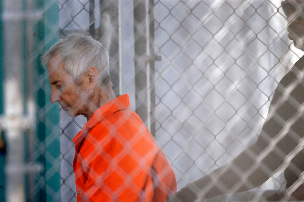 Robert Durst is escorted into Orleans Parish Prison after his arraignment in Orleans Parish Criminal District Court in New Orleans, on March 17, 2015.