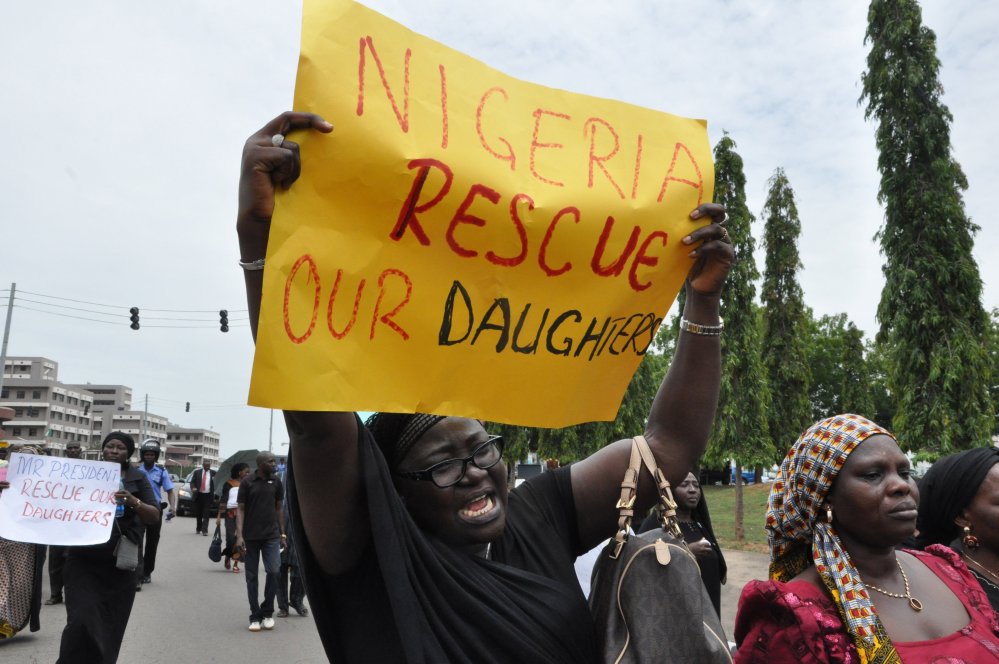 An unidentified mother cries out during a demonstration with others who have daughters among the kidnapped school girls of government secondary school Chibok, April 29, 2014, in Abuja, Nigeria.