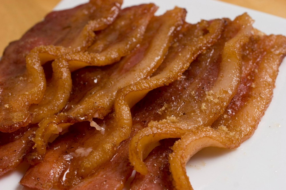 This Bacon with Brown Sugar and Cardamom takes a breakfast staple to a whole new level. Oven baking also makes it easy to cook and clean up. (AP Photo/Larry Crowe)