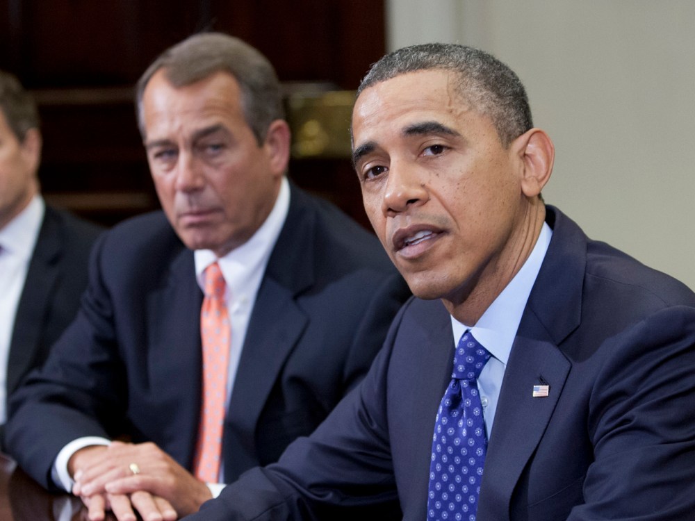 US President Barack Obama speaks before Speaker John Boehner and other cabinet members about the fiscal cliff. (Toby Jorrin / AFP)