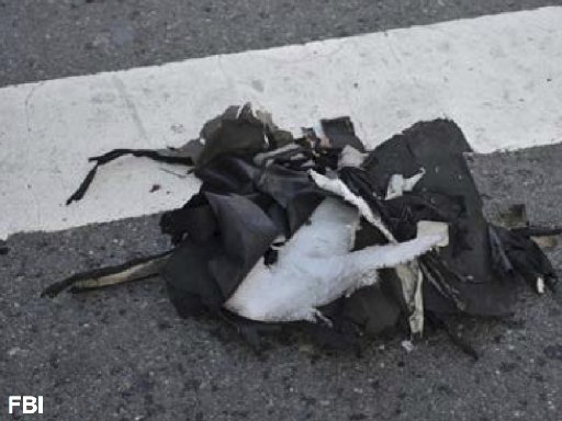This image from a Federal Bureau of Investigation and Department of Homeland Security joint bulletin issued to law enforcement and obtained by The Associated Press, shows the remains of a black backpack that the FBI says contained one of the bombs that...