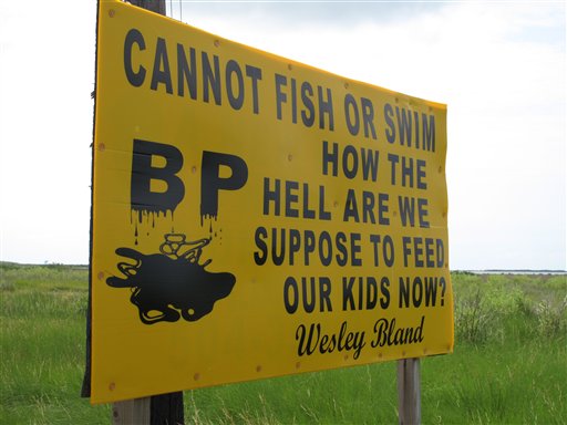 A sign along the highway near Grand Isle, La., on July 11, 2010, lays out the problem many struggling fishing families now face: With their fishing grounds closed by the oil spill in the Gulf of Mexico, they are forced to find something other than...
