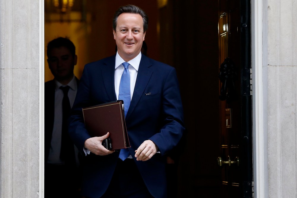 Britain's Prime Minister David Cameron smiles as he leaves 10 Downing Street in London, on Nov. 20, 2014.