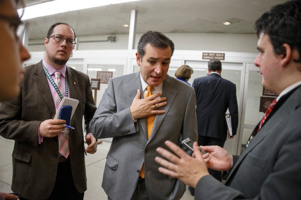 Sen. Ted Cruz, R-Texas speaks with reporters on Capitol Hill in Washington, Tuesday, Dec. 17, 2013.