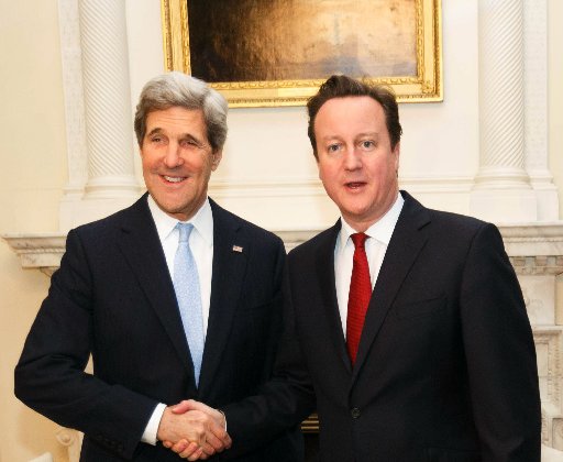 LONDON, ENGLAND - FEBRUARY 25:  British Prime  David Cameron (R) shakes hands with US Secretary of State John Kerry inside 10 Downing Street on February 25, 2013 in London, England. Mr Kerry is on an 11-day tour and is due to visit Berlin, Paris, Rome,...