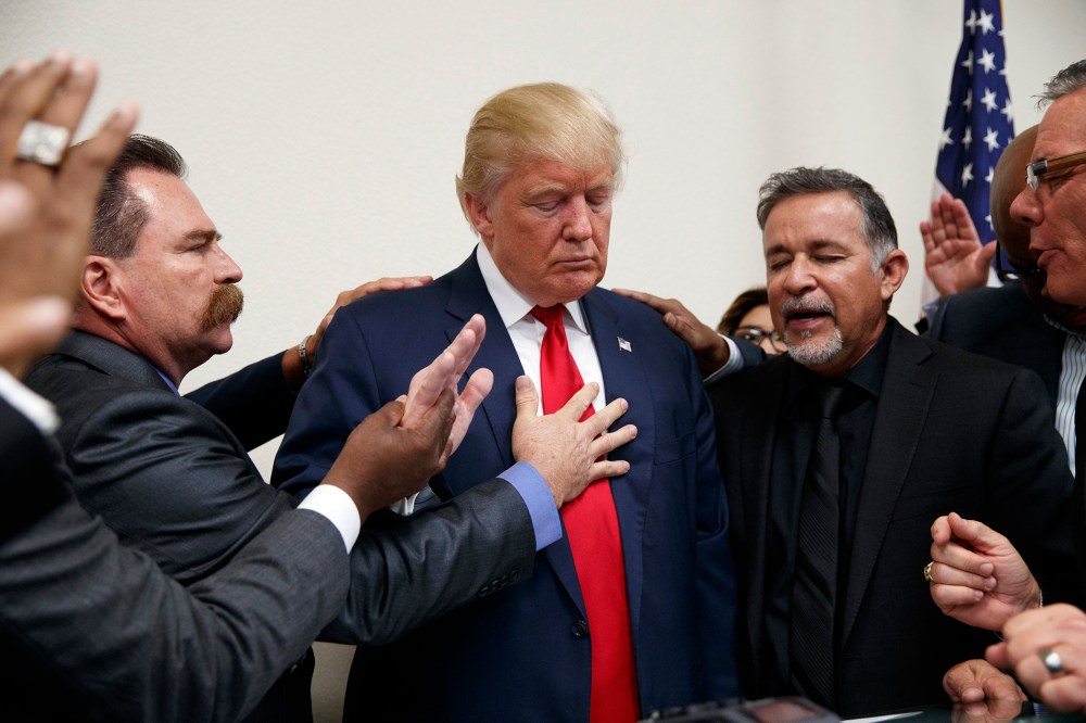 Pastors from the Las Vegas area pray with Republican presidential candidate Donald Trump during a visit to the International Church of Las Vegas, and International Christian Academy on Oct. 5, 2016, in Las Vegas, Nev. (Photo by Evan Vucci/AP)