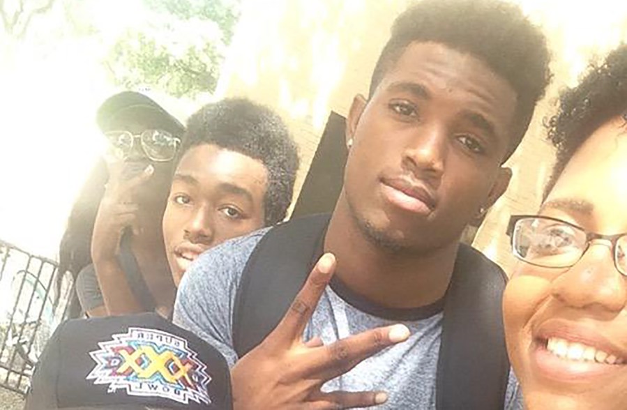 Christian Taylor, pictured with a gray shirt and black backpack, in a photograph taken by his friend and classmate, Liz. (Photo courtesy of @_lawjohnson)