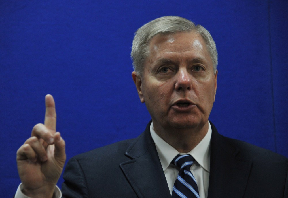 Senator Lindsey Graham speaks as he takes part in a press conference at the U.S. Embassy in Kabul on January 2, 2014.