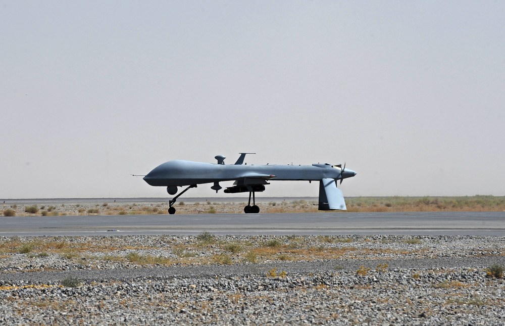 FILE - In this June 13, 2010, file photo a U.S. Predator unmanned drone armed with a missile stands on the tarmac of Kandahar military airport in Afghanistan. Hunting al-Qaida targets from Pakistan to Afghanistan, Yemen to Somalia, the fleet of U.S....