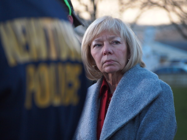 Newtown Superintendent of Schools Janet Robinson, in the background, was among officials at a press conference at Treadwell Park in Newtown on Dec. 14, 2012, in the wake of a shooting at Sandy Hook School that claimed the life of 26, including 20...