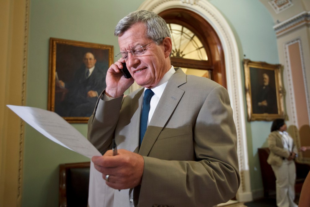 Sen. Max Baucus, D-Mont, steps off the Senate floor just after the bipartisan passage of the Farm Bill, at the Capitol in Washington, Thursday, June 21, 2012.