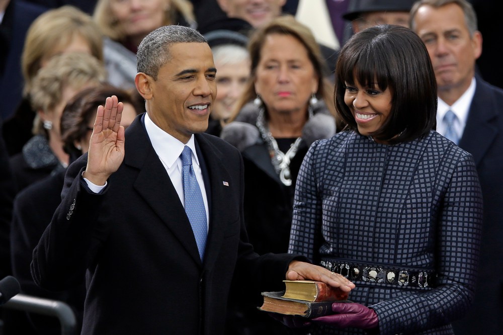 President Barack Obama receives the oath of office from Chief Justice John Roberts as first lady Michelle Obams and his daughters Malia and Sasha look on at the ceremonial swearing-in at the U.S. Capitol during the 57th Presidential Inauguration in...