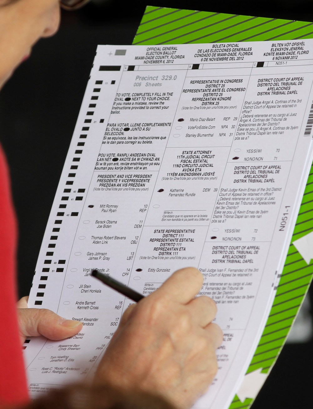 A voter marks her ballot in Hialeah, Fla., on Election Day, Tuesday, Nov. 6, 2012. (AP Photo/Alan Diaz)