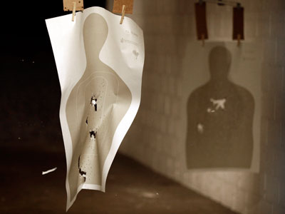Participants of Armed Citizen Project making use of a paper target at a shooting range in Houston, Texas on May 19, 2013. (Photo by Pat Sullivan/AP)