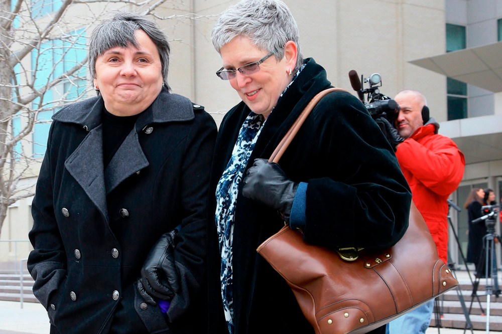 Susan Waters, left, and Sally Waters walk away from Federal Court in Omaha, Neb., after a hearing, Feb. 19, 2015. (Photo by Nati Harnik/AP)