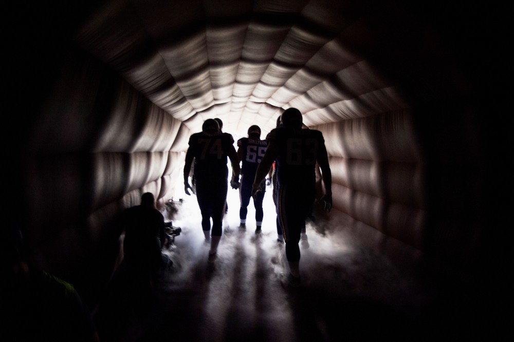 Football players on Oct. 27, 2013 in Minneapolis, Minn. (Photo by Hannah Foslien/Getty)