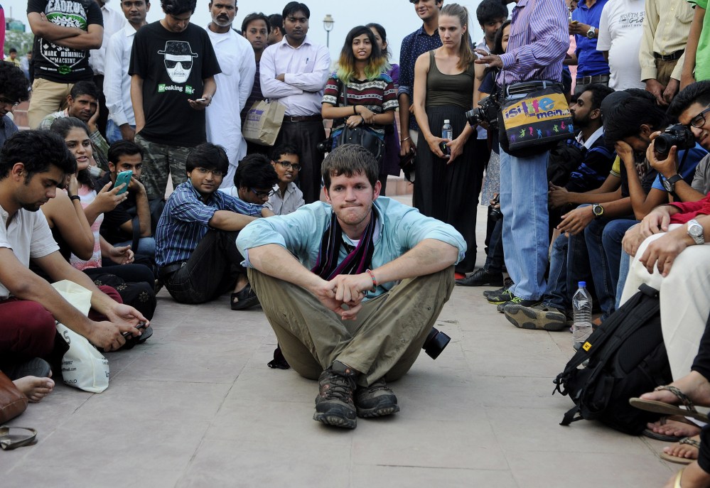 American photographer and blogger Brandon Stanton with his young followers in Central Park at Connaught Place on Sep. 12, 2014 in New Delhi, India. (Photo by Vipin Kumar/Hindustan Times/Getty)