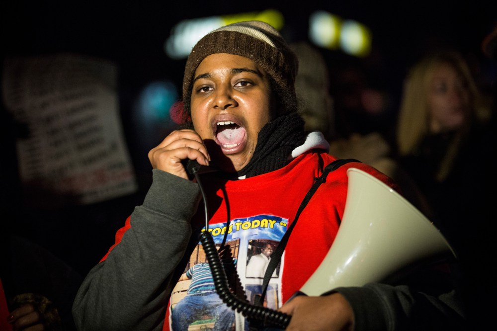 Erica Garner, daughter of Eric Garner, leads a march protesting in Staten Island, N.Y., after a grand jury's decision not to indict a police officer involved in her father's chokehold death in July, on Dec. 11, 2014. (Photo by Andrew Burton/Getty)