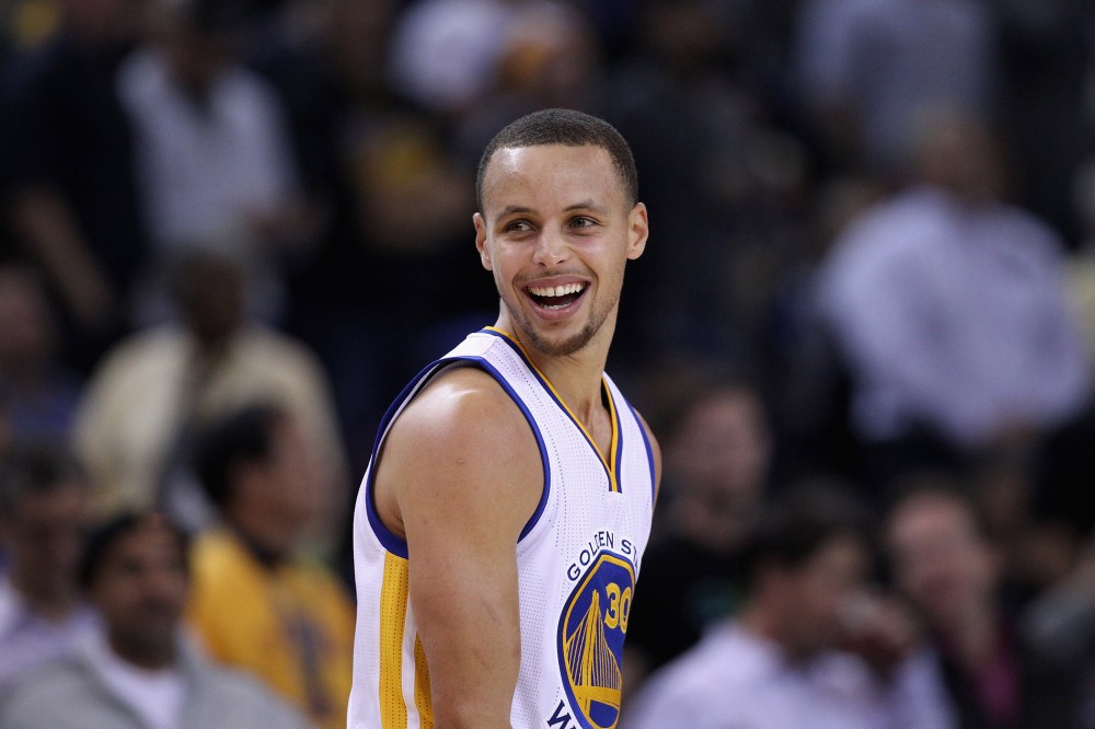 Stephen Curry #30 of the Golden State Warriors smiles during their game against the Indiana Pacers at ORACLE Arena on Jan. 7, 2015 in Oakland, Calif. (Photo by Ezra Shaw/Getty)