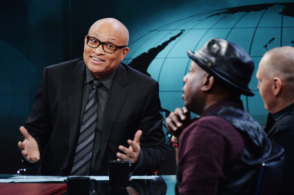 Larry Wilmore jokes with hip-hop artist/activist Talib Kweli and comedian Bill Burr on the debut episode of Comedy Central's "The Nightly Show with Larry Wilmore" on Jan. 19, 2015 in New York City. (Photo by Stephen Lovekin/Comedy Central/Getty)