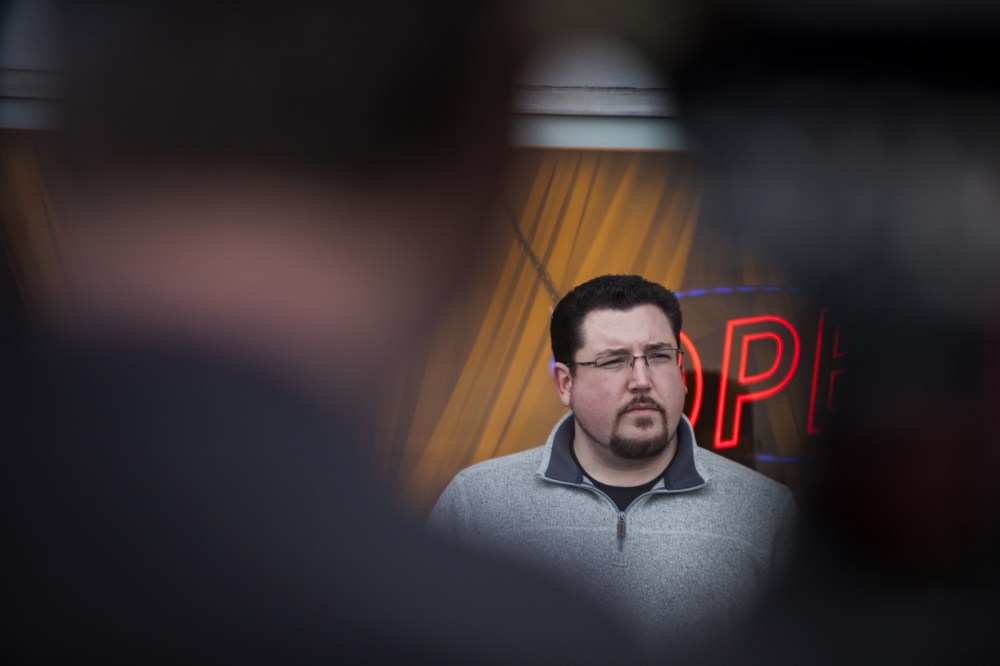 Ferguson Mayor James Knowles stands with members of the business community during a press conference in Ferguson, Mo., March 14, 2015. (Photo by Samuel Corum/Anadolu Agency/Getty)