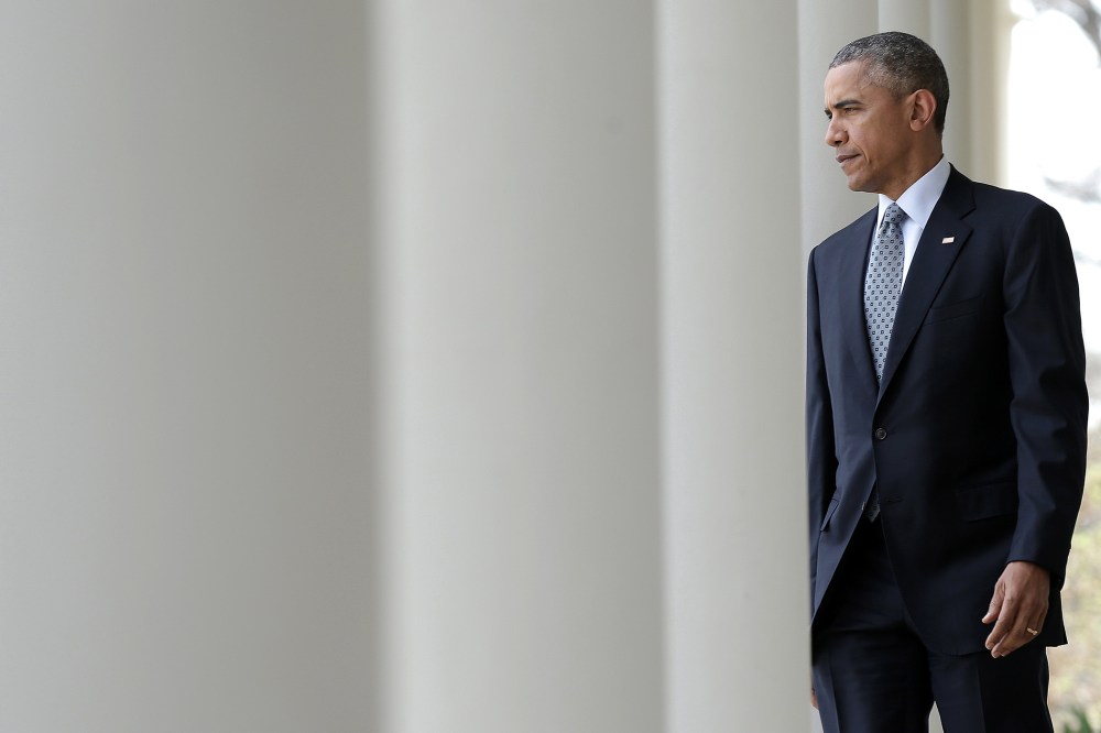 President Barack Obama walks from the Oval Office to the Rose Garden to deliver remarks on April 2, 2015 in Washington, D.C. (Photo by Win McNamee/Getty)