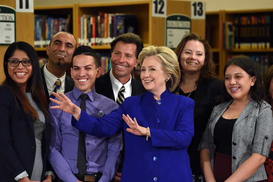 Democratic presidential candidate and former U.S. Secretary of State Hillary Clinton poses with students and faculty after speaking at Rancho High School on May 5, 2015 in Las Vegas, Nev. (Photo by Ethan Miller/Getty)