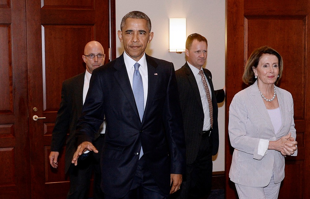 U.S. President Barack Obama and House Minority Leader Nancy Pelosi leave the Gabriel Zimmerman room on Capitol Hill, June 12, 2015 in Washington, D.C. (Photo by Olivier Douliery-Pool/Getty)