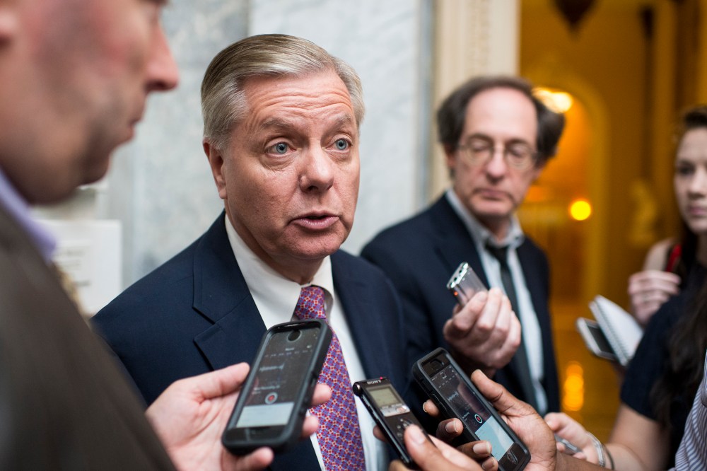 Sen. Lindsey Graham speaks with reporters as he leaves the Senate Republicans' policy lunch on June 16, 2015. (Photo by Bill Clark/CQ Roll Call/Getty)