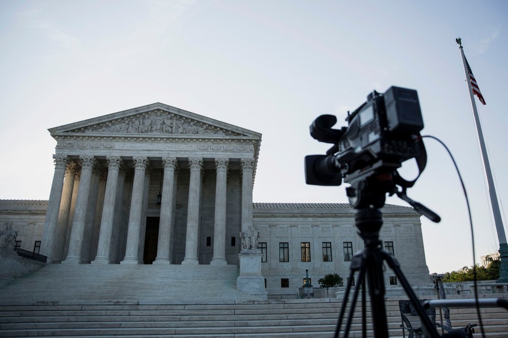 A camera sits on a tripod in front of the U.S. Supreme Court in Washington, D.C. (Drew Angerer/Bloomberg/Getty).