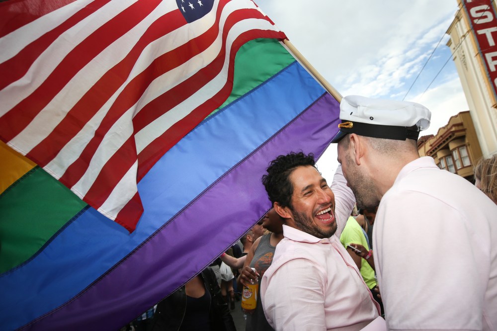 Francisco Pavon and his friend Brandon McCarthy celebrate in front of San Francisco's iconic Castro Theater during gay pride weekend on June 27, 2015 in San Francisco, Calif. (Photo by Elijah Nouvelage/Getty)
