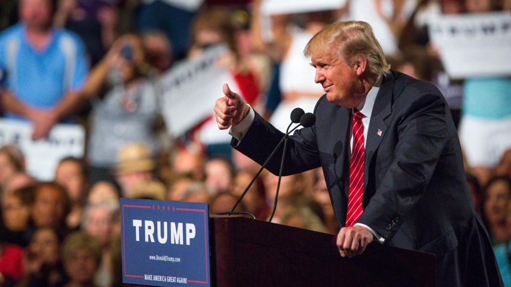 Republican Presidential candidate Donald Trump addresses supporters during a political rally at the Phoenix Convention Center on July 11, 2015 in Phoenix, Ariz. (Photo by Charlie Leight/Getty)