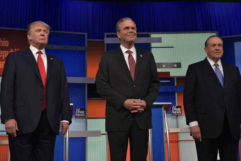 Real estate tycoon Donald Trump, former Florida governor Jeb Bush, and former Arkansas governor Mike Huckabee at Republican debate Aug. 6, 2015. (Photo by Mandel Ngan/ AFP/Getty)