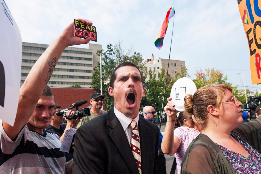 A protestor yells out against same-sex marriage supporters in front of the federal courthouse September 3, 2015 in Ashland, Kentucky. (Photo by Ty Wright/Getty)