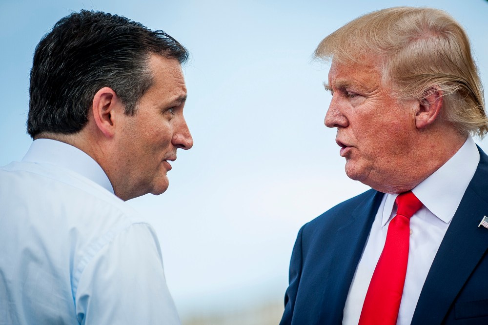 Sen. Ted Cruz speaks with Donald Trump during a Tea Party Patriots rally against the Iran nuclear deal on Capitol Hill in Washington, D.C., U.S., on Sept. 9, 2015. (Photo by Pete Marovich/Bloomberg/Getty)