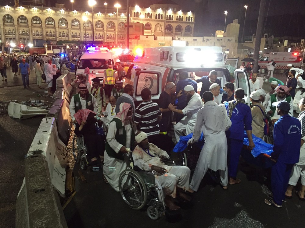 Paramedics and officials hospitalize wounded people after a construction crane collapsed over the Muslim pilgrims around the Muslims' holy place Kaaba in Mecca, Saudi Arabia on Sep. 11, 2015. (Photo by Ozkan Bilgin/Anadolu Agency/Getty)